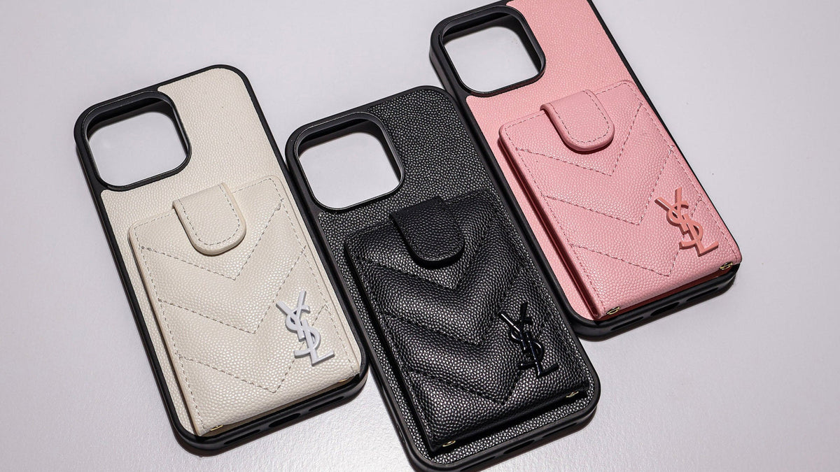 White, black and pink card-holder phone cases showing camera cutouts