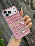 Pink monogram iPhone case with a back grip strap