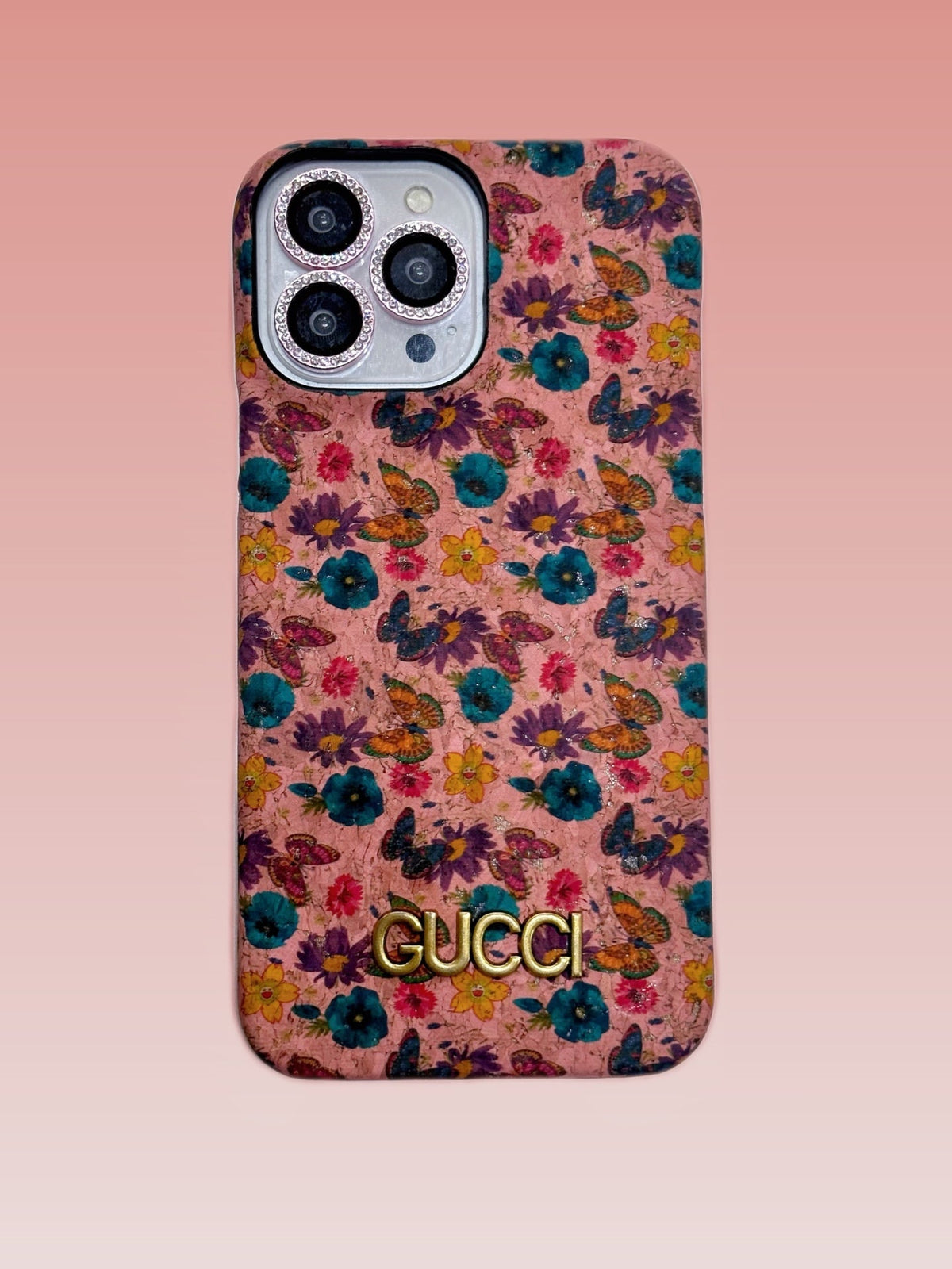 Multicolor floral iPhone case with a gold-tone central emblem