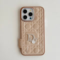 Champagne quilted iPhone case with a back grip tab and silver-tone emblem