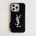 Black quilted iPhone case with a back grip tab and silver-tone initials