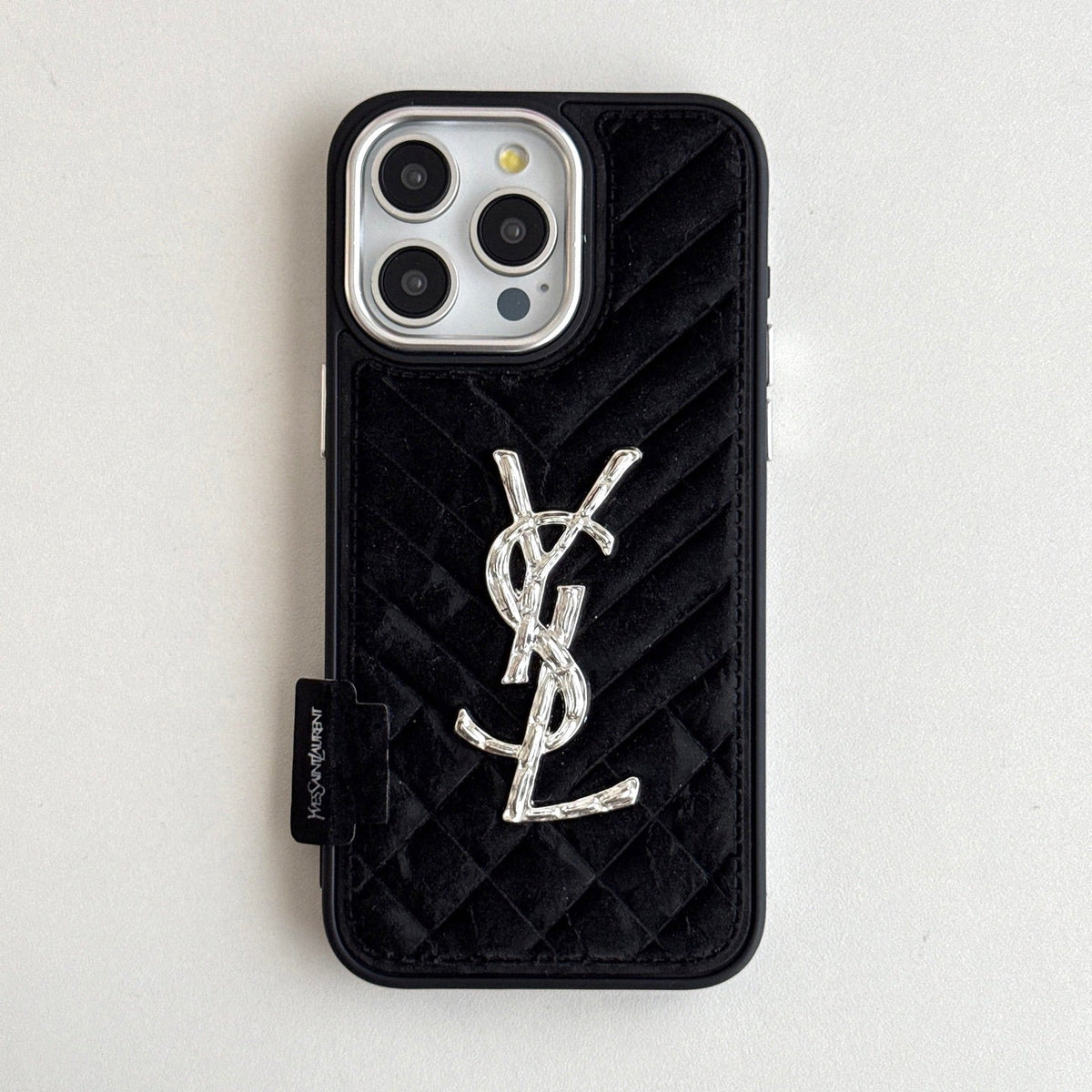 Black quilted iPhone case with a back grip tab and silver-tone initials