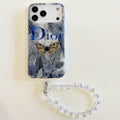 Blue botanical iPhone case with animal-print details and a beaded wrist strap