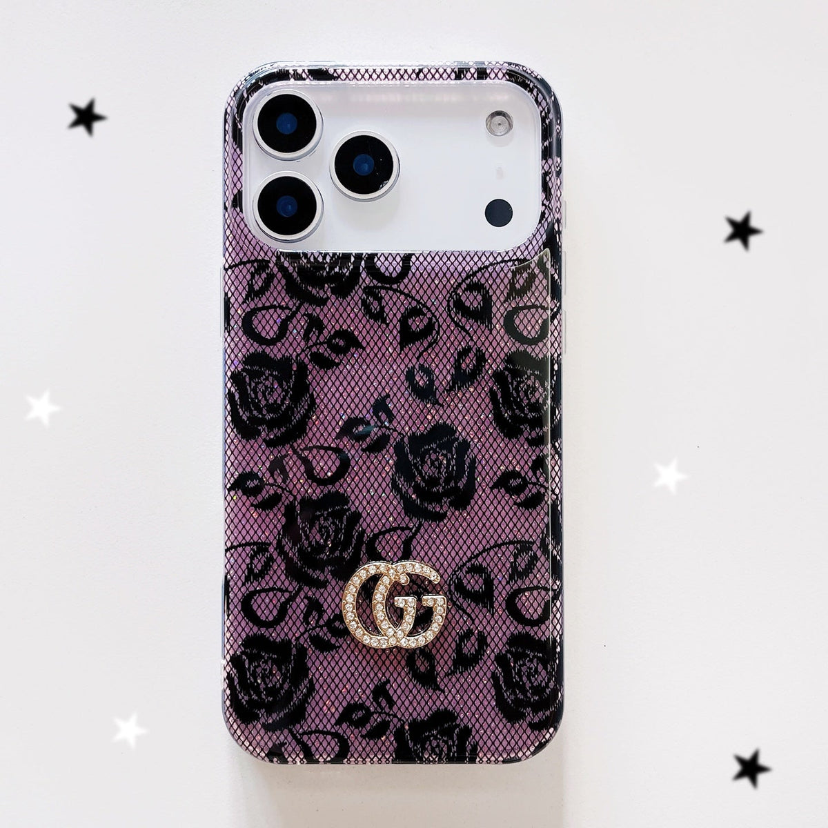 Purple and black floral monogram iPhone case with a gold-tone emblem
