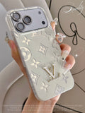 Clear and white monogram iPhone case with raised floral motifs
