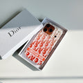 Coral monogram-print iPhone case displayed in a presentation box