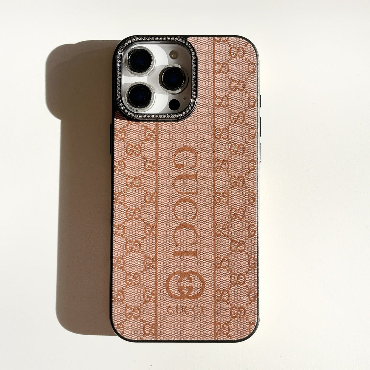 Blush monogram iPhone case with a vertical center stripe