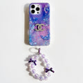 Purple and blue marble-effect iPhone case with butterfly details and a beaded wrist strap