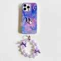 Purple and blue marble-effect iPhone case with a butterfly wrist strap