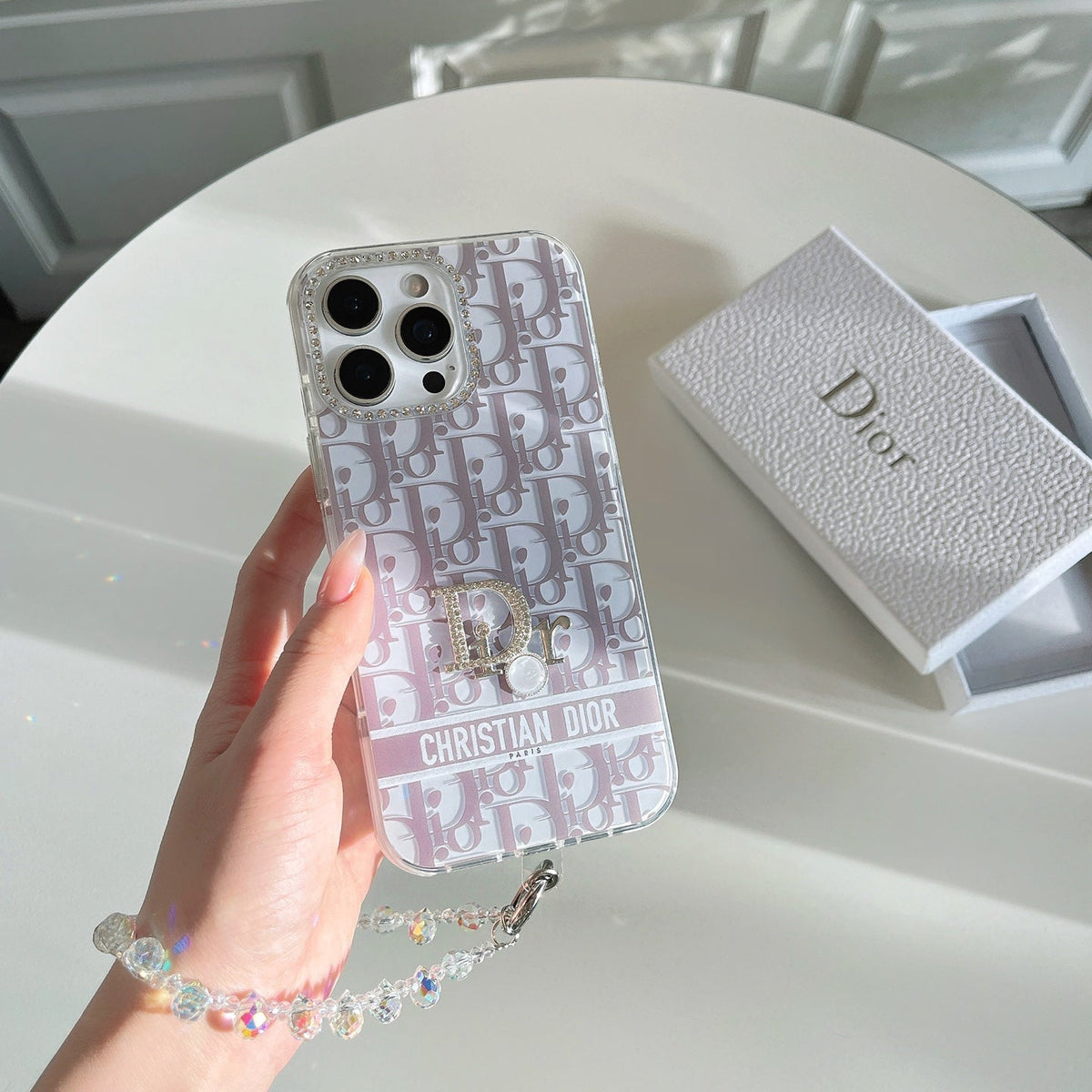 Pale lilac monogram-print iPhone case with a circular logo detail