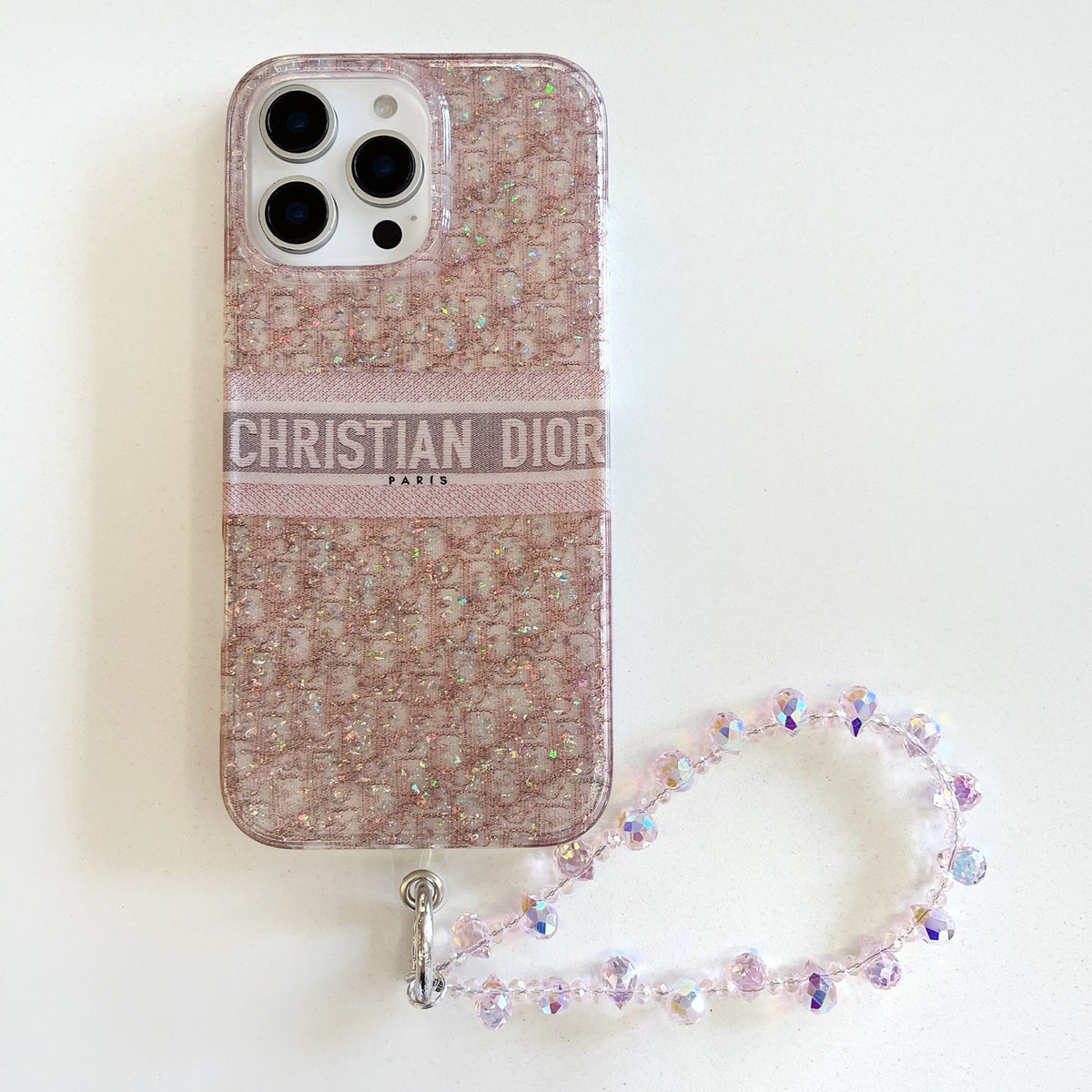 Blush monogram-print iPhone case with a beaded wrist strap