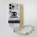 White floral logo iPhone case with a pearl-style wrist strap