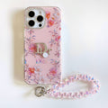 Pink floral iPhone case with a beaded wrist strap