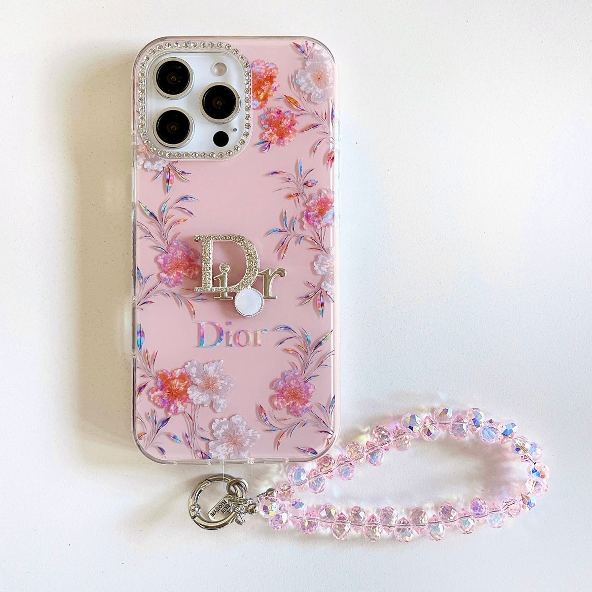 Pink floral iPhone case with a beaded wrist strap