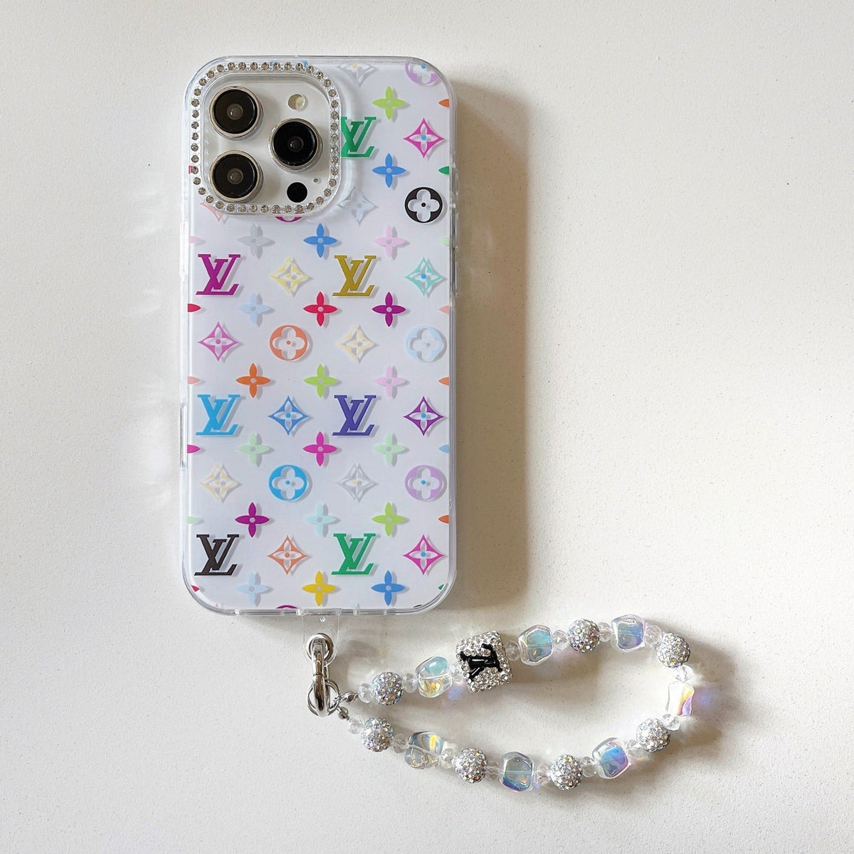 White multicolor monogram iPhone case with a beaded wrist strap