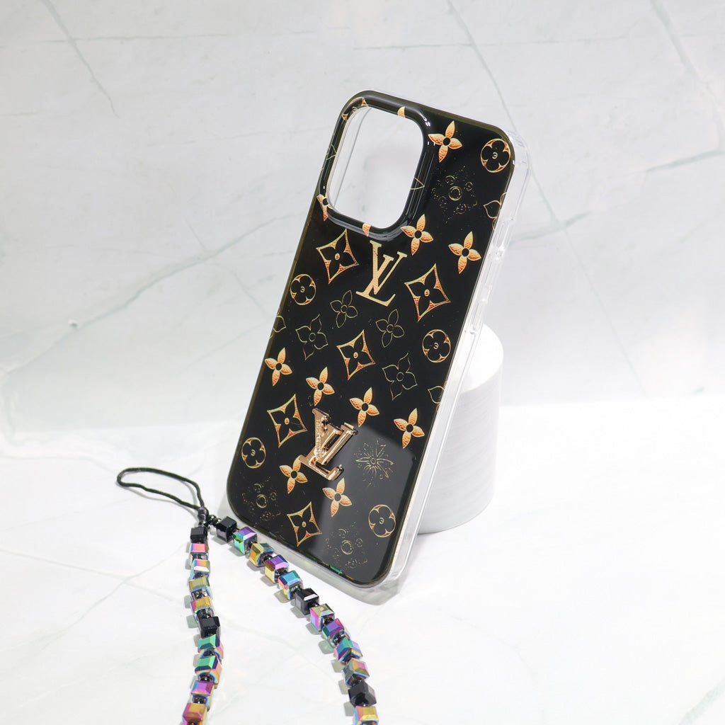 Close-up of the black LV iPhone case highlighting the golden monogram pattern and leather finish