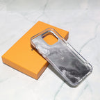 Black LV iPhone case with golden monogram showing the fitted protective back and slim edges