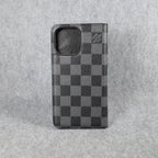 Black LV iPhone wallet case back view showing the dark leather folding cover