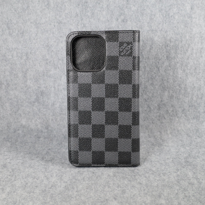 Black LV iPhone wallet case back view showing the dark leather folding cover