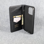 Black LV iPhone wallet case interior view showing the card storage and fitted phone shell