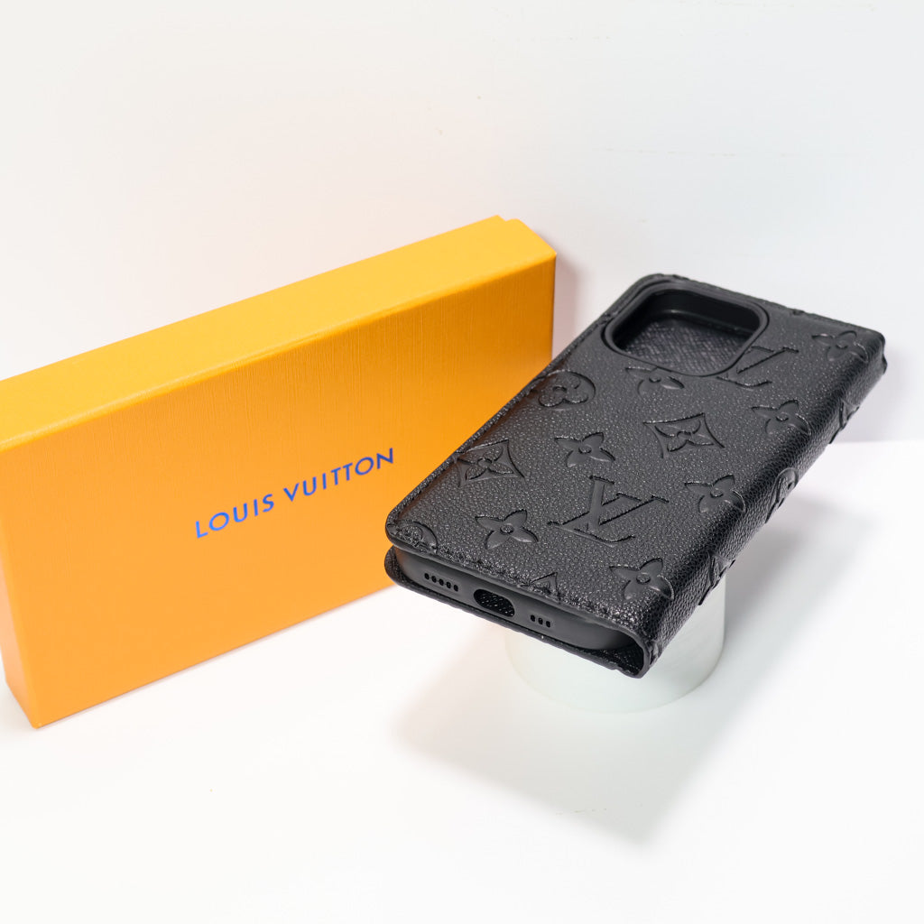 Black wallet iPhone case showing the card holder interior and protective folio cover