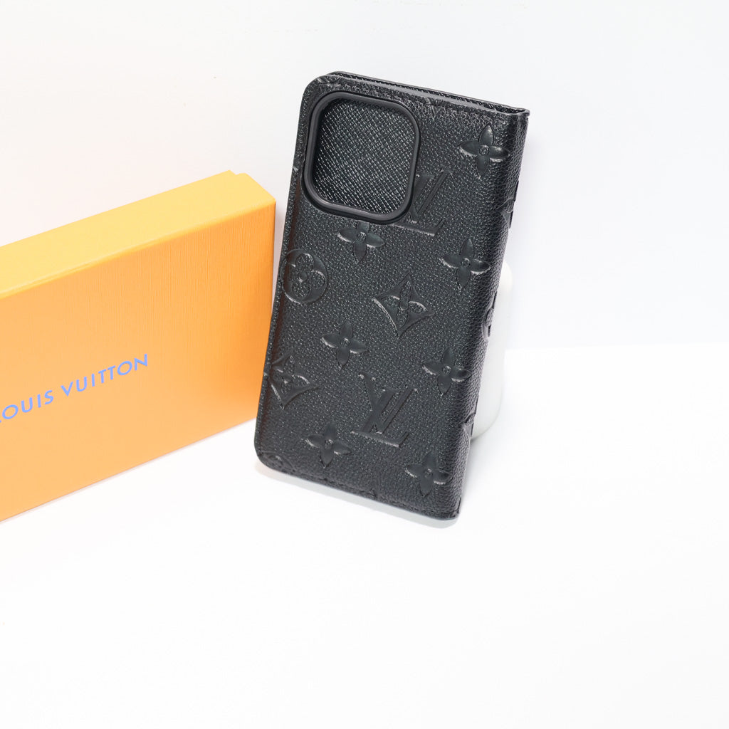Black LV wallet iPhone case showing the folding cover and integrated card storage