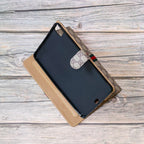 Close-up of the GG iPad case showing the patterned cover and folding folio construction