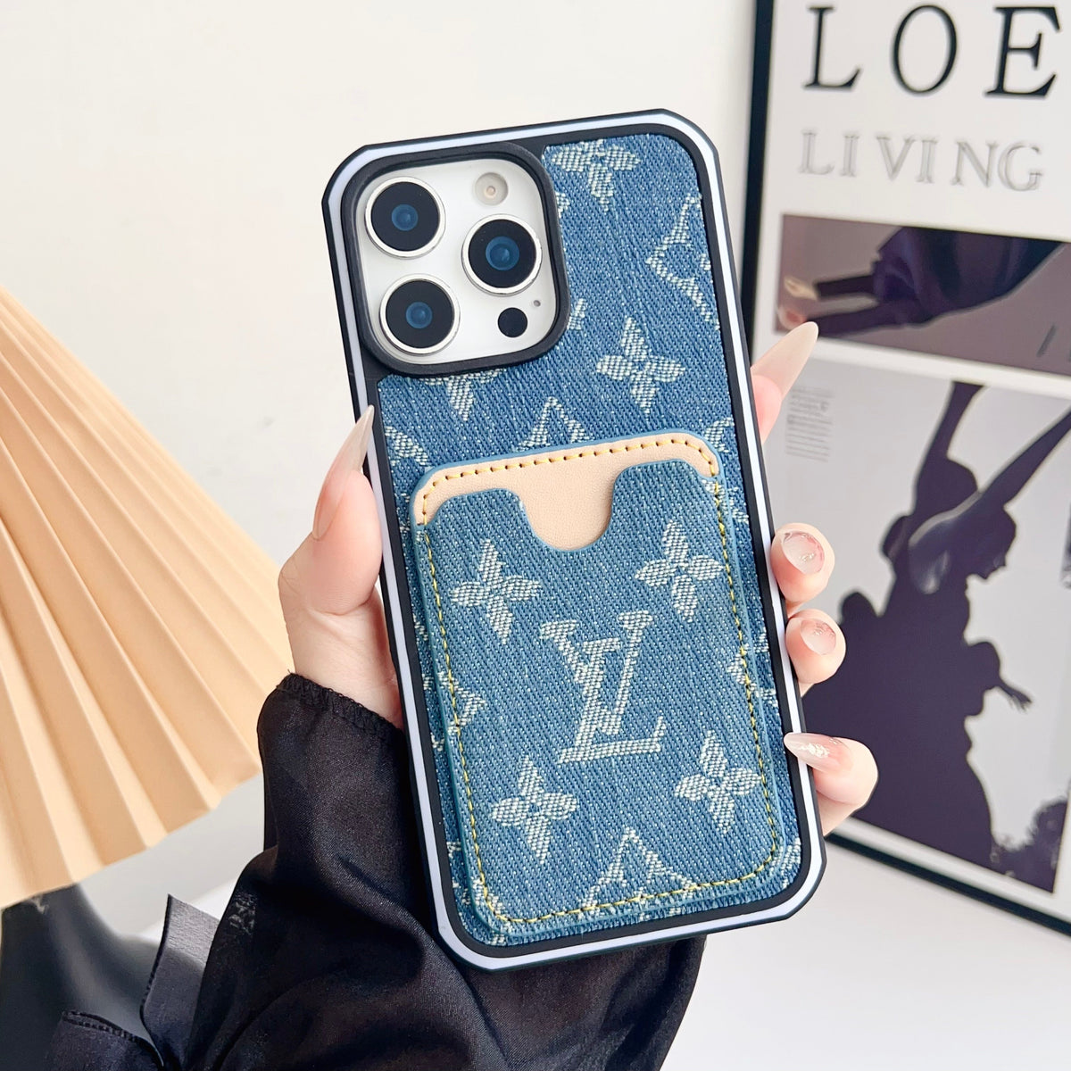 Blue fabric LV iPhone card slot case showing the textured finish and fitted back cover