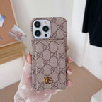 Beige GG style folding iPhone case showing the card holder and protective folio design