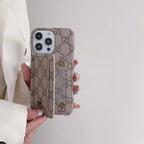 GG style iPhone card slot case showing the patterned wallet cover and camera opening