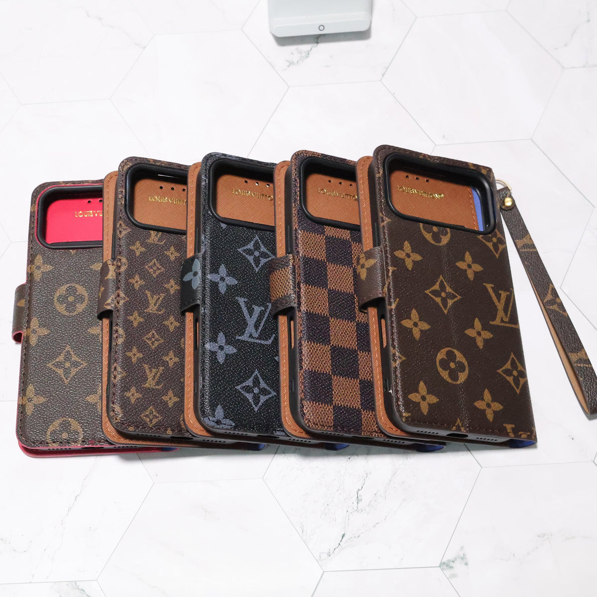 LV folio wallet iPhone case with edge patches showing the folding cover and patterned finish