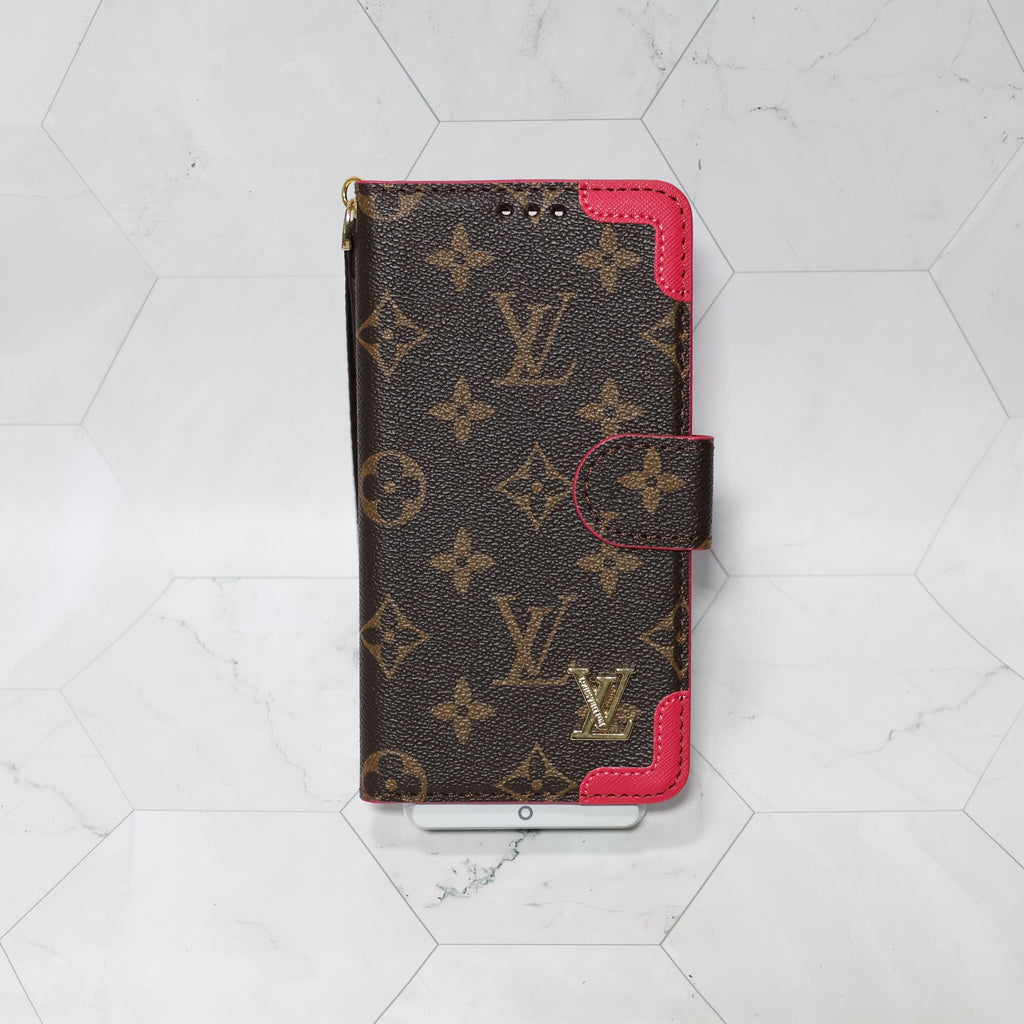 LV folio wallet iPhone case with edge patches showing the slim protective profile and leather finish
