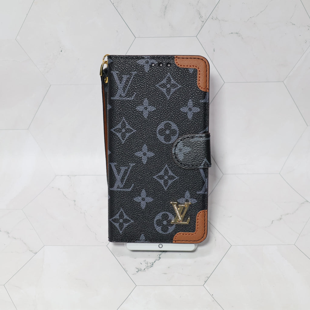 LV folio wallet iPhone case with edge patches close-up showing protective corners and texture