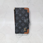 LV folio wallet iPhone case with edge patches close-up showing protective corners and texture
