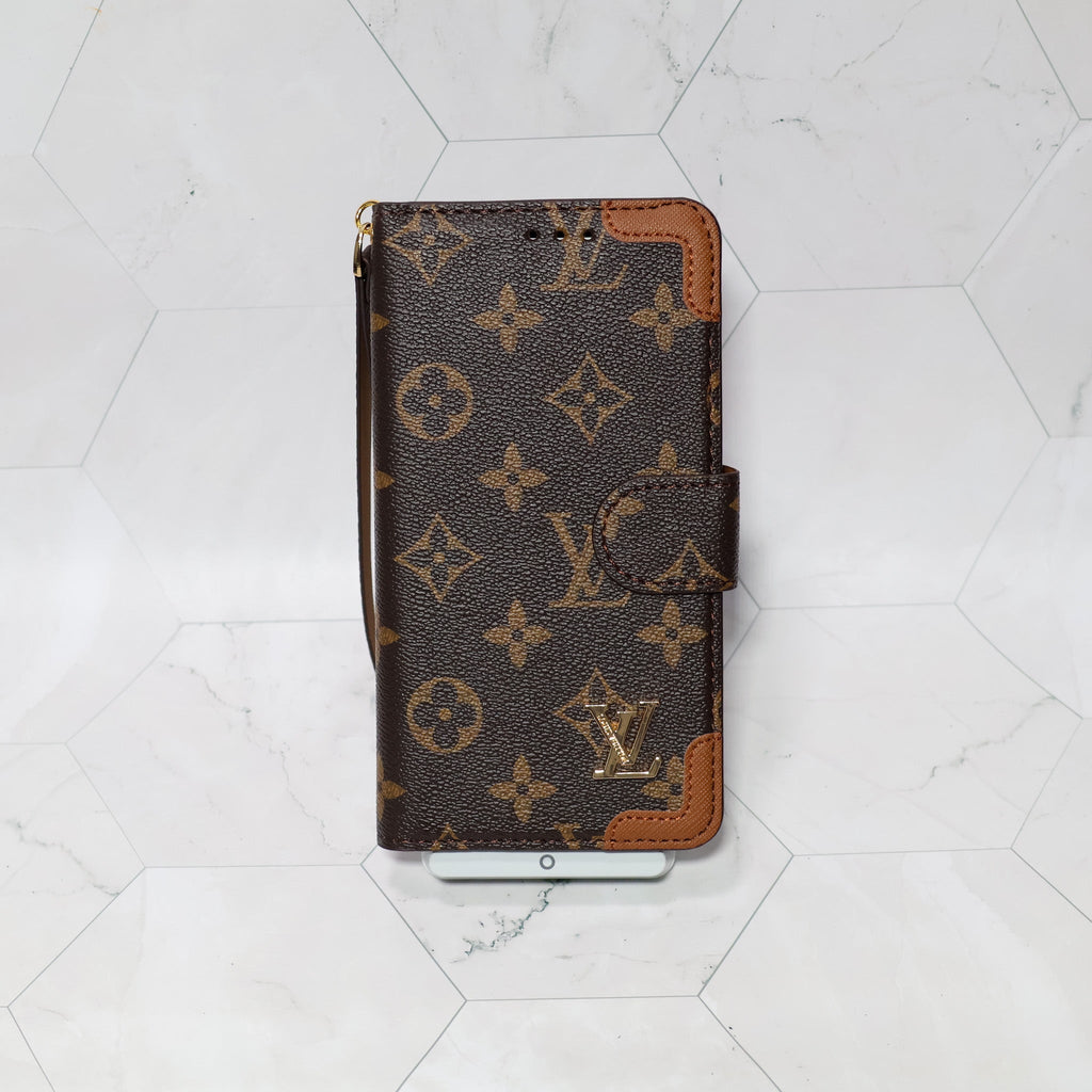 LV folio wallet iPhone case with edge patches showing the complete wallet-style protective design