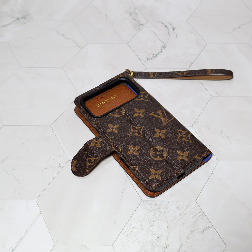 LV folio wallet iPhone case with edge patches close-up showing the wallet cover and rear design