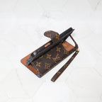 LV folio wallet iPhone case with edge patches close-up showing material texture and card storage