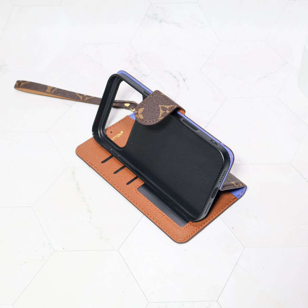 LV folio wallet iPhone case with edge patches showing the full patterned cover and fitted corners