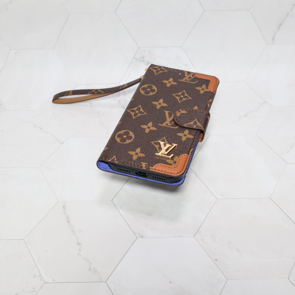 LV folio wallet iPhone case with edge patches showing the patterned leather and protective fit