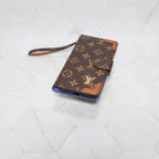 LV folio wallet iPhone case with edge patches showing the patterned leather and protective fit
