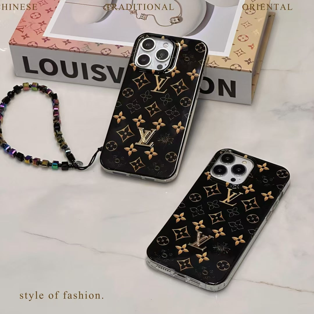 Black LV iPhone case with golden monogram showing the complete protective rear cover