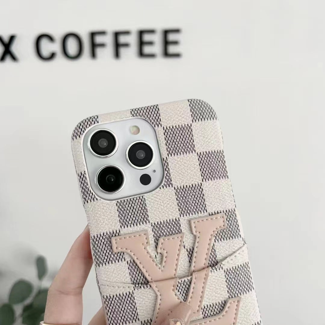 White checkered LV iPhone card holder case showing the camera opening and raised edge