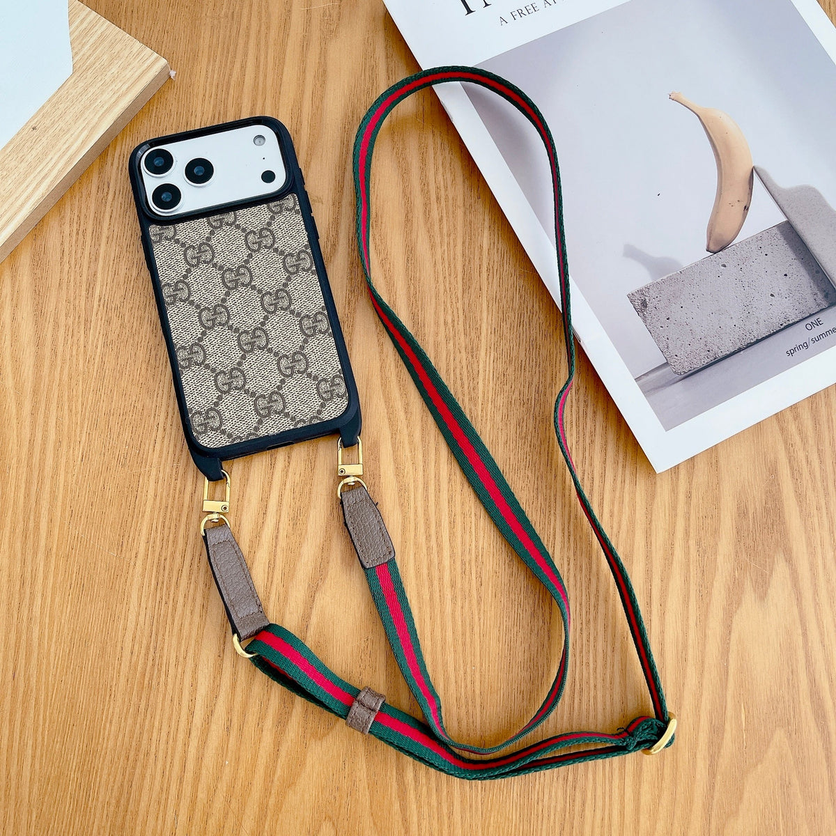Classic monogram LV crossbody iPhone case showing the rear design and shoulder strap hardware