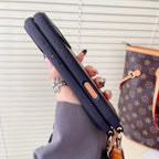 Classic monogram LV crossbody iPhone case showing the full leather pattern and fitted corners