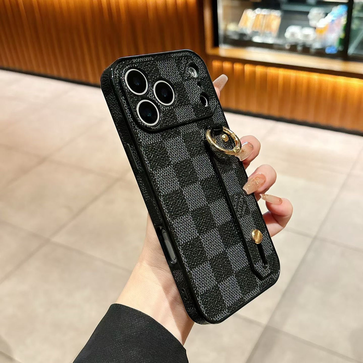Hand strap back cover iPhone case showing the slim edge profile and patterned finish
