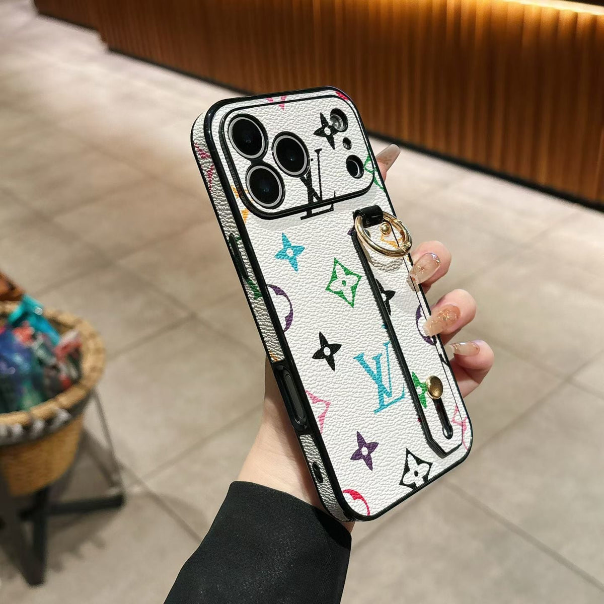 Hand strap back cover case for iPhone showing the complete patterned exterior