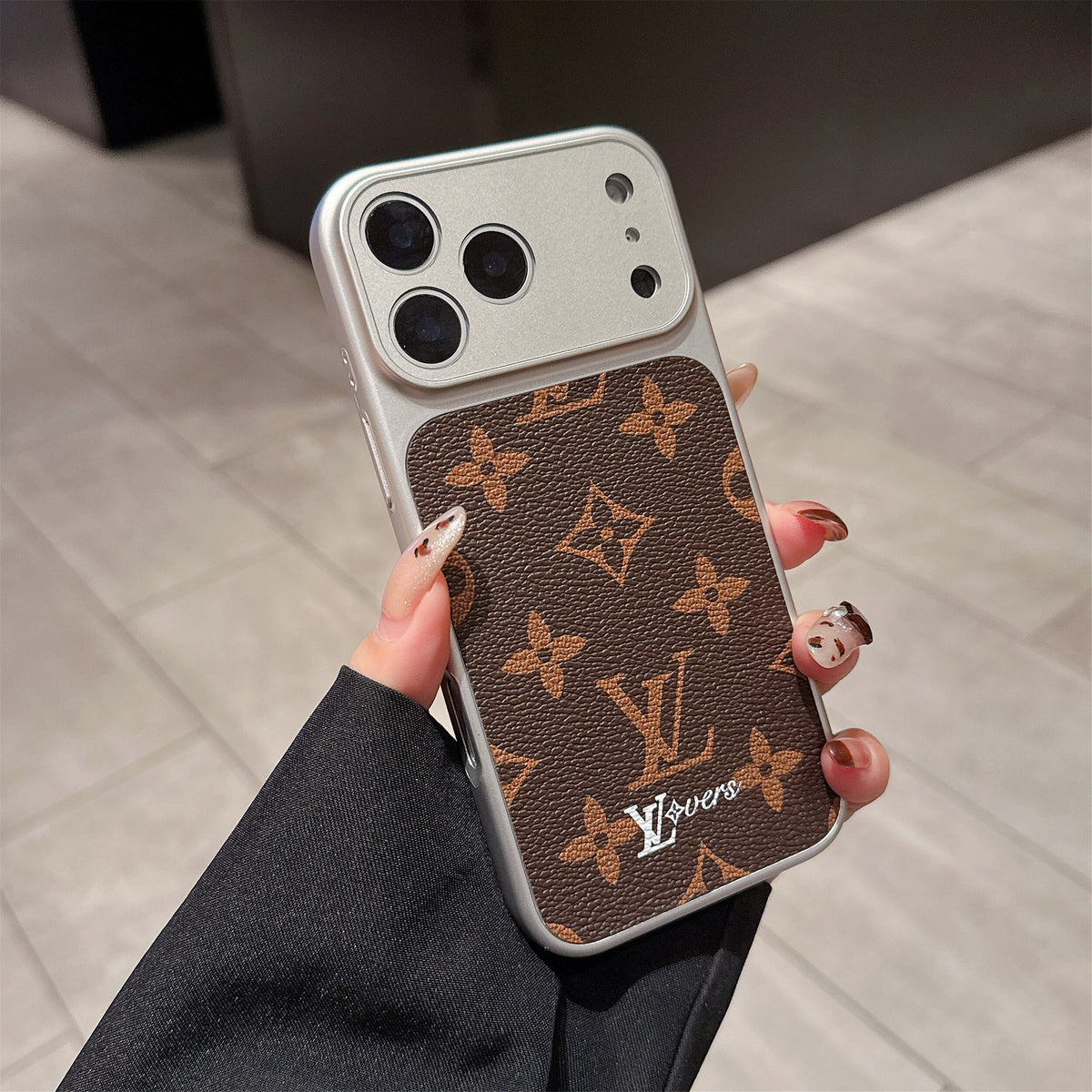 LV lens protection iPhone case close-up showing the reinforced camera guard and fitted cover
