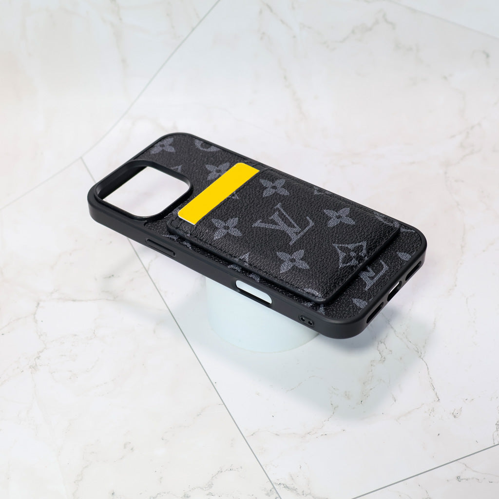 Detailed view of the Louis V MagSafe iPhone case with card holder and patterned finish