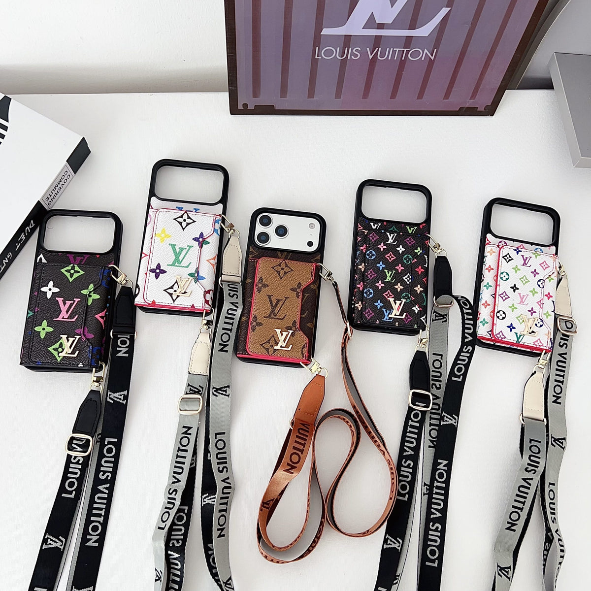 Multicolor monogram LV crossbody wallet iPhone case showing the strap and patterned back