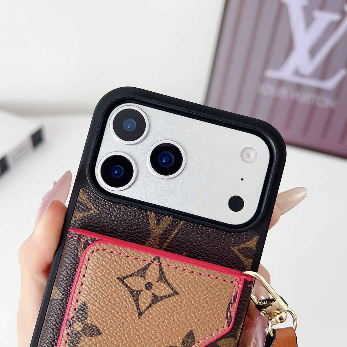 Multicolor monogram LV crossbody wallet iPhone case showing strap hardware and the patterned cover